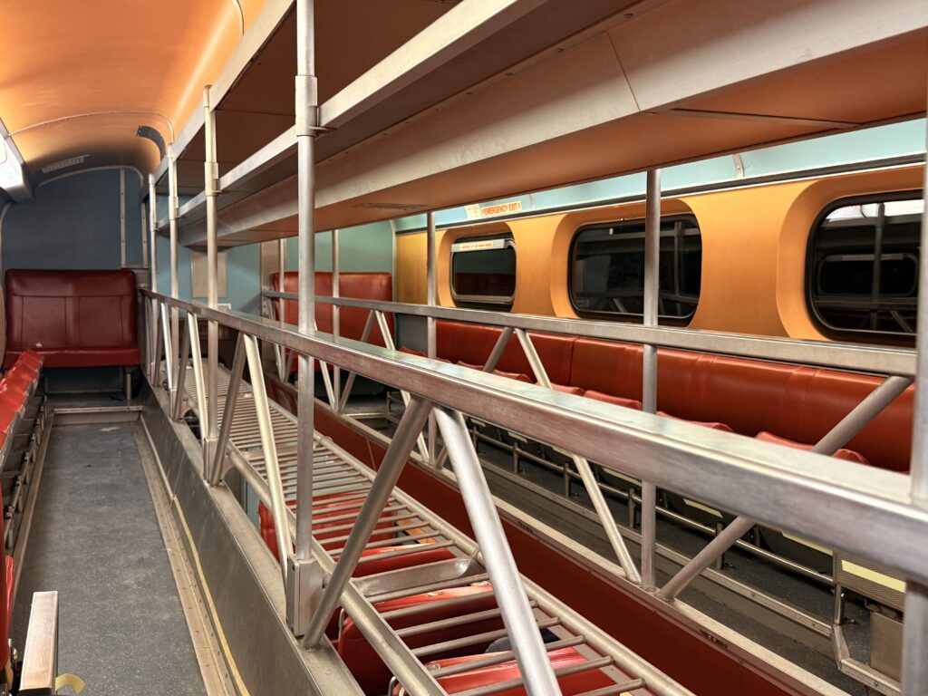 The interior of a train car, photographed in black and white. The image links to the page "Matter & Mercy"
